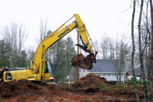 A excatator used to pull tree stumps and grub a building lot