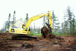 Prepairing a building lot for a foundation with the aid of a excavator