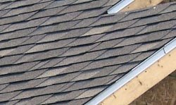 A picture of  architectural shingles on a roof.