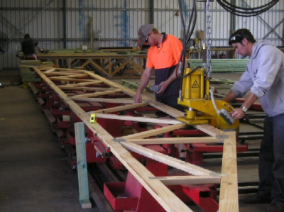 Roof trusses being built in a factory